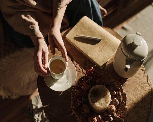 A quiet morning scene with tea and a notebook in a Peruvian home