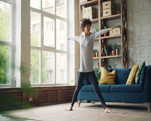 Gentle stretching routine in a well lit living room